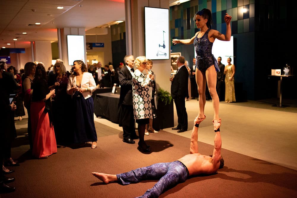 Guests being entertained by acrobat performers in in the Heaphy Prefunction room
