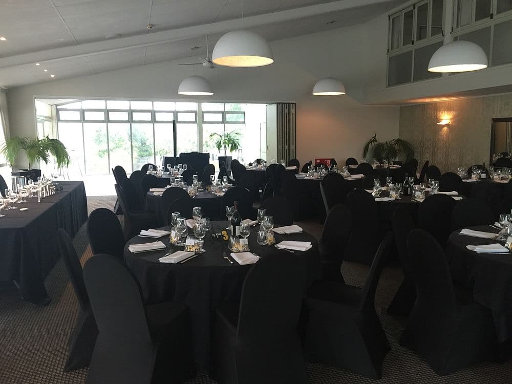 Simple black linen on wedding tables set up for a wedding reception at The Ferrybank