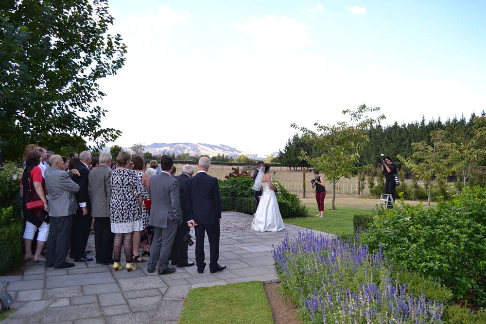 Henley Hotel - Bride and Groom with family posing for photographer
