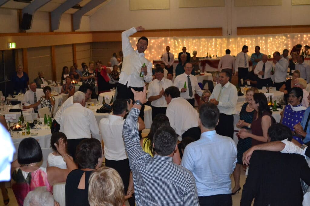 Matamata Civic Centre - Wedding reception groom dancing on table