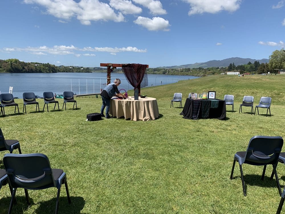 Sir Don Rowlands Centre - Wedding ceremony table setting with registration table over looking the lake