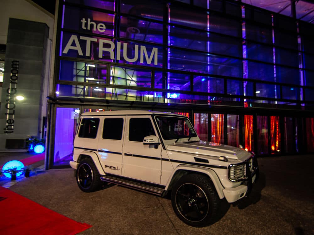 The Atrium - Entry doors with vehicle parked outside