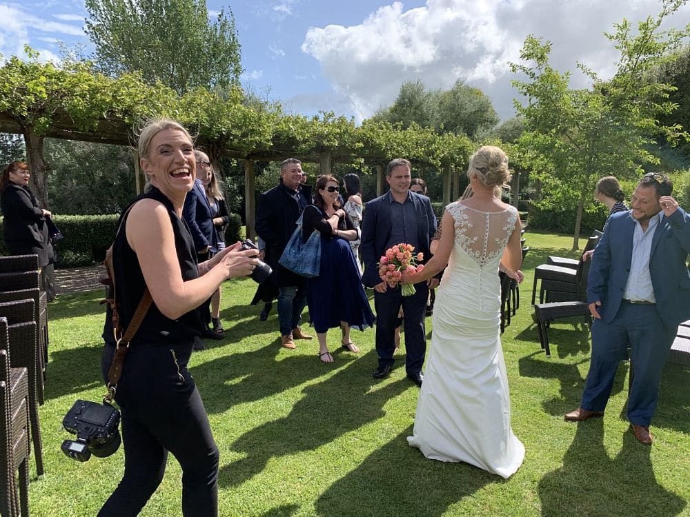 The Boatshed Karapiro - Wedding photographer laughing at the camera