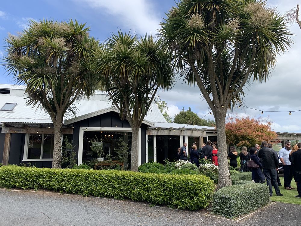The Boatshed Karapiro - Guests mingling outside
