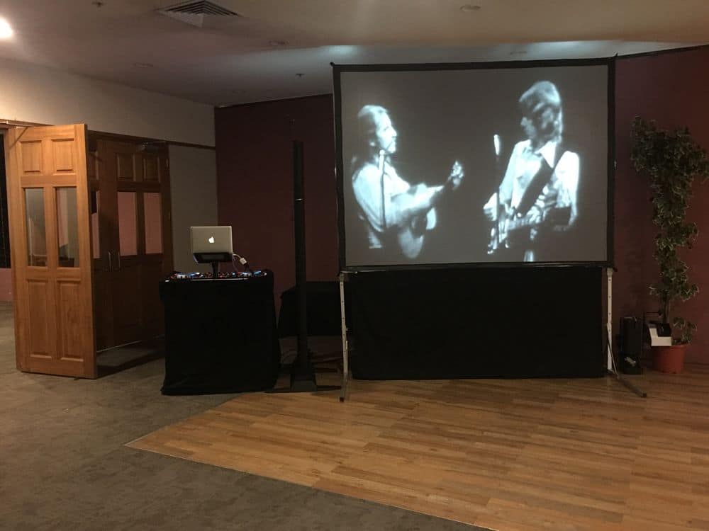 The Distinction Hotel Hamilton - COnference room DJ Set Up Next to Bar with Video Screen