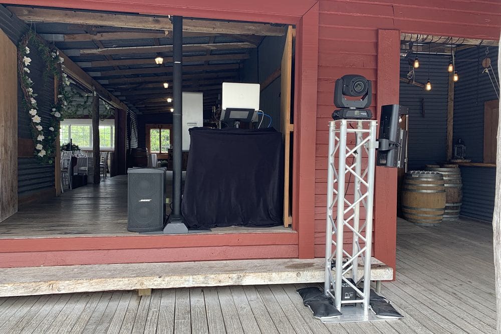 The Red Barn - DJ equipment with disco lights on truss tower