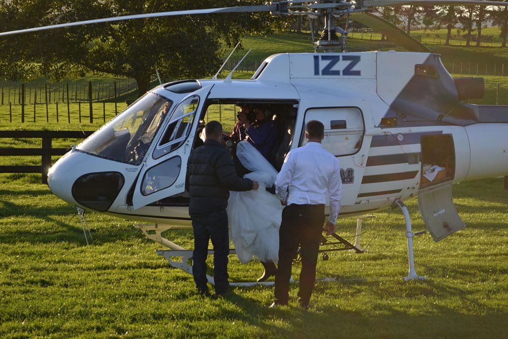 The Red Barn - Bride and groom boarding helicopter