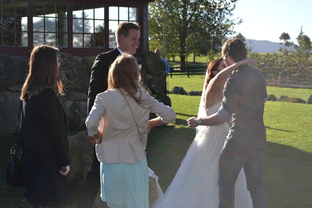 The Red Barn - Guests congratulating bride and groom