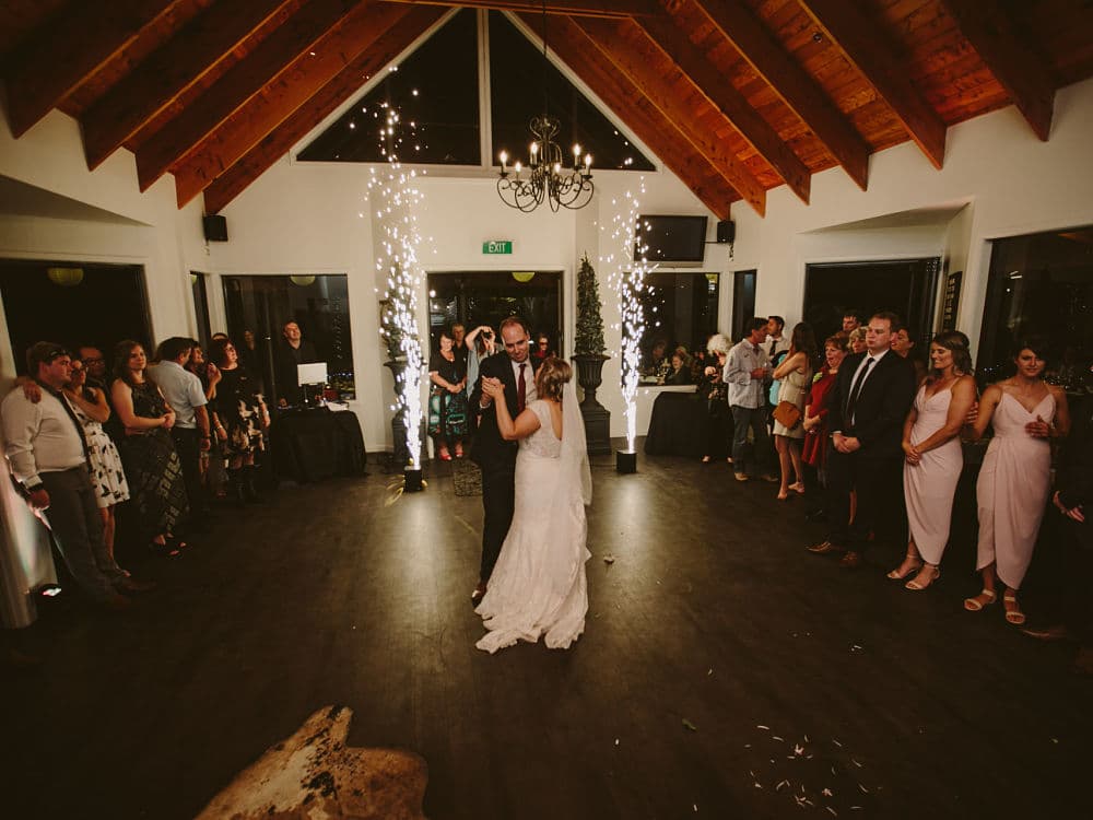 Woodside Estate - Bride and Groom dancing with two pyrotechnics behind them