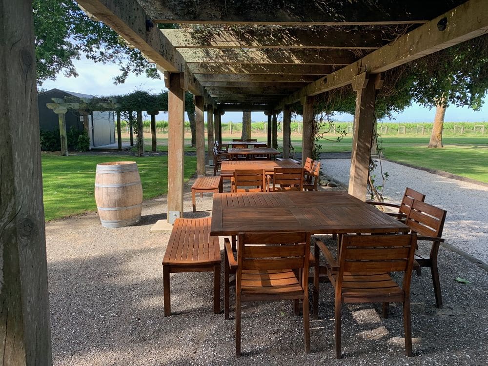 Te Awa Winery - Outdoor picnic tables under the grape vine covered pergola