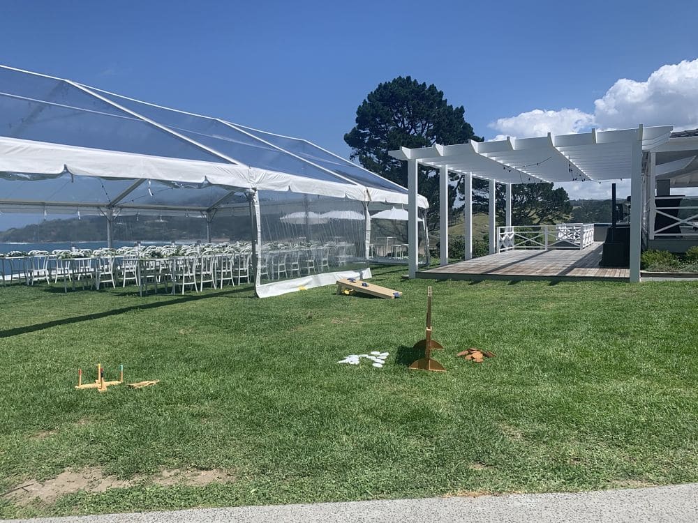 Orua Beach House - Marquee set for wedding and out door games set on lawn