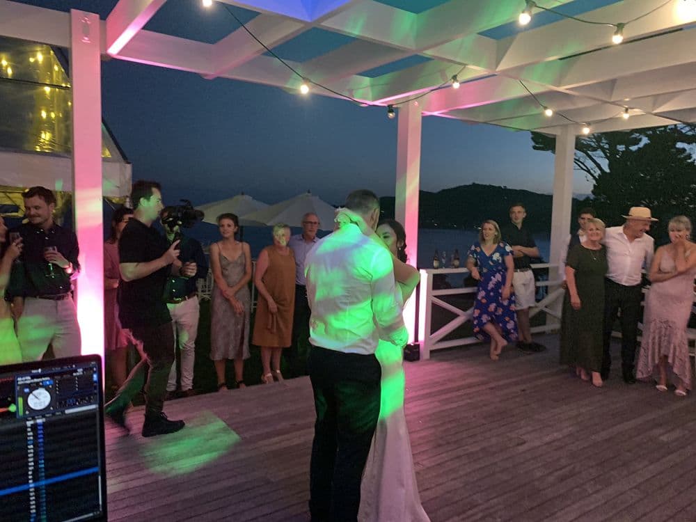 Orua Beach House - Bride and Groom first dance on deck